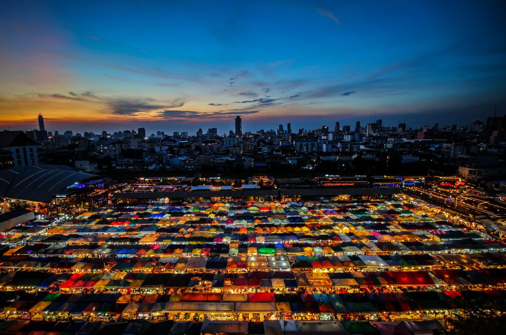 A lit up market after the sunset