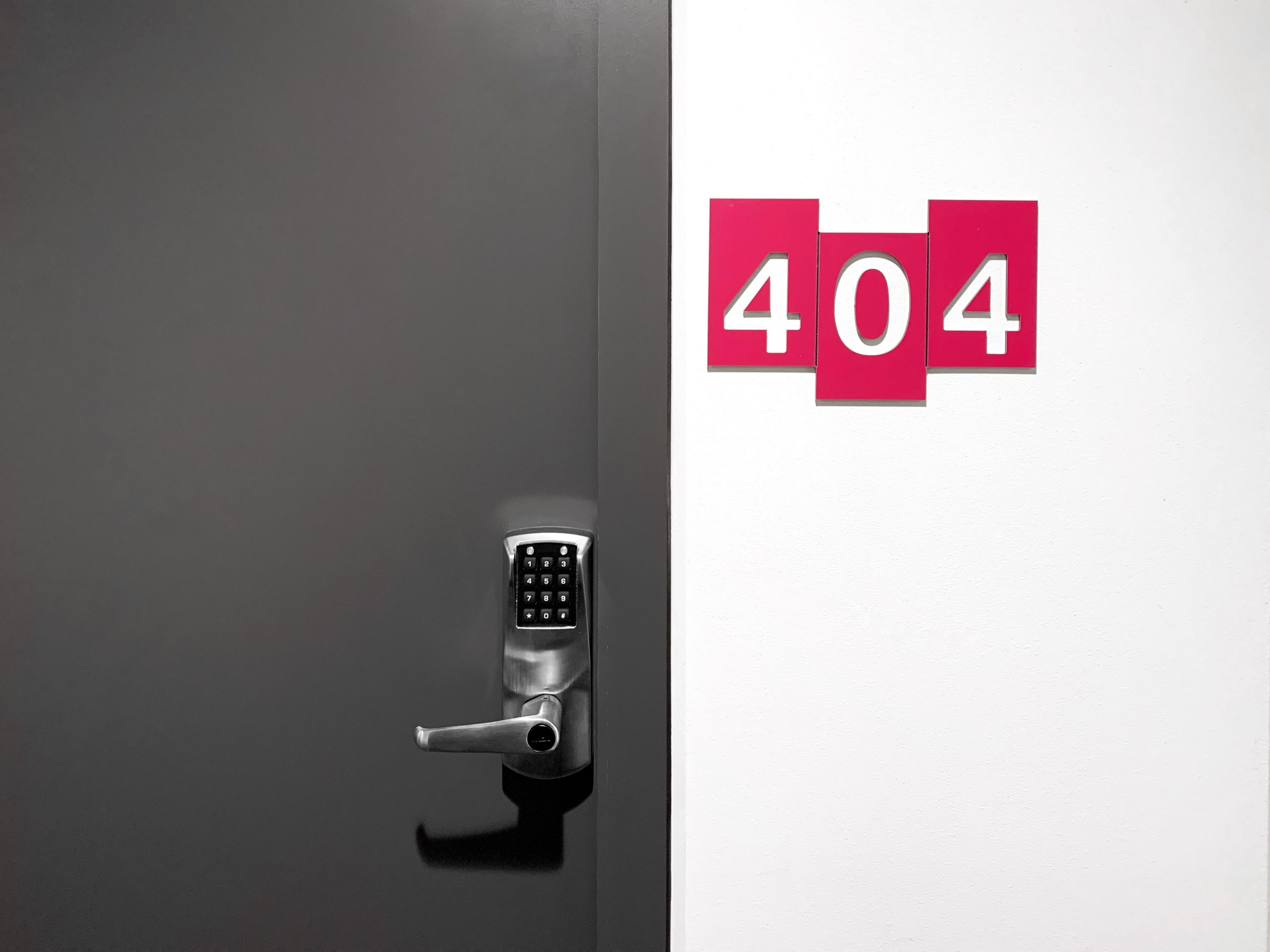 Door with 404 sign on the wall